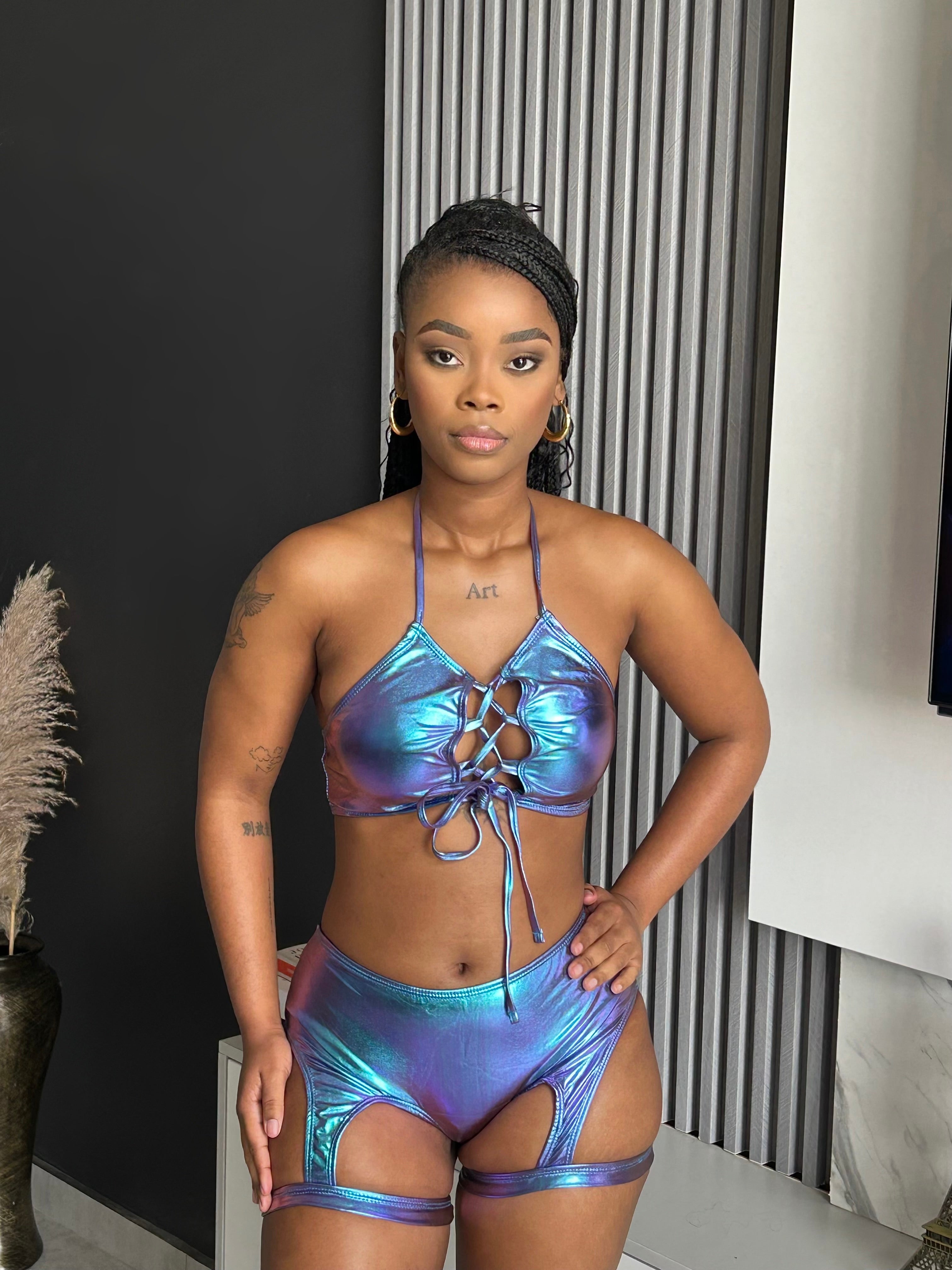 Model wearing the Wafiya Metallic Two-Piece Set, featuring a lace-up top and high-waisted bottoms, from Vera’s Closet.