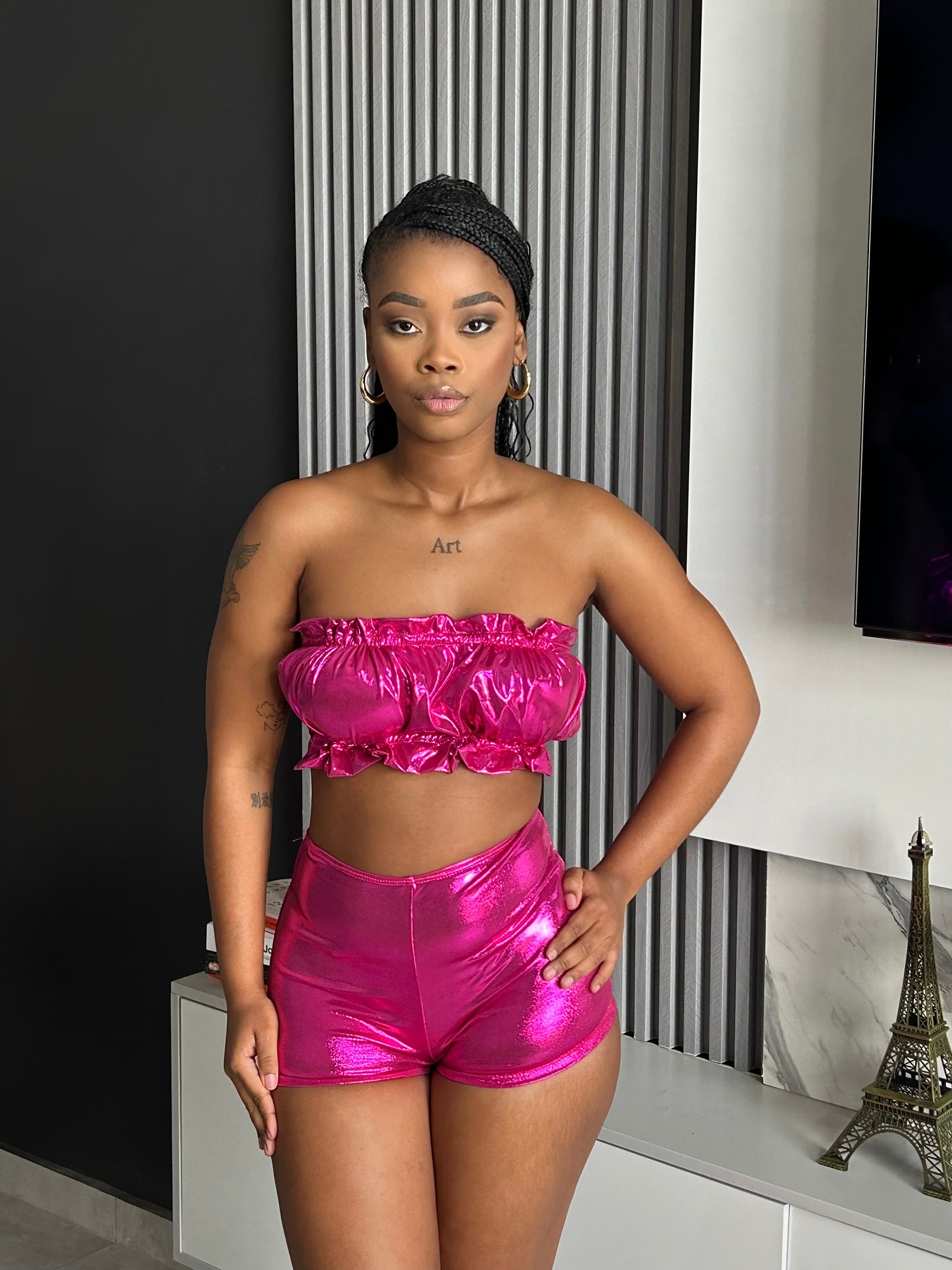 Model wearing the Dropped Metallic Tube Set, a bold two-piece outfit with a metallic tube top and matching shorts.