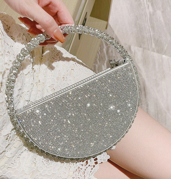 Stella Crystal Evening Bag with sparkling rhinestones and a beaded handle.