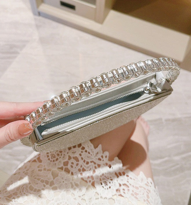 Stella Crystal Evening Bag with sparkling rhinestones and a beaded handle.