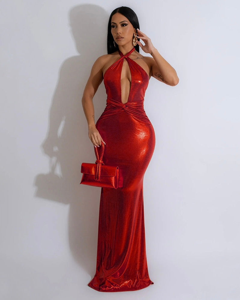 Striking red halter neck evening gown featuring a shimmering fabric and form-fitting silhouette. Perfect for elevating your style and making a statement at elegant events.