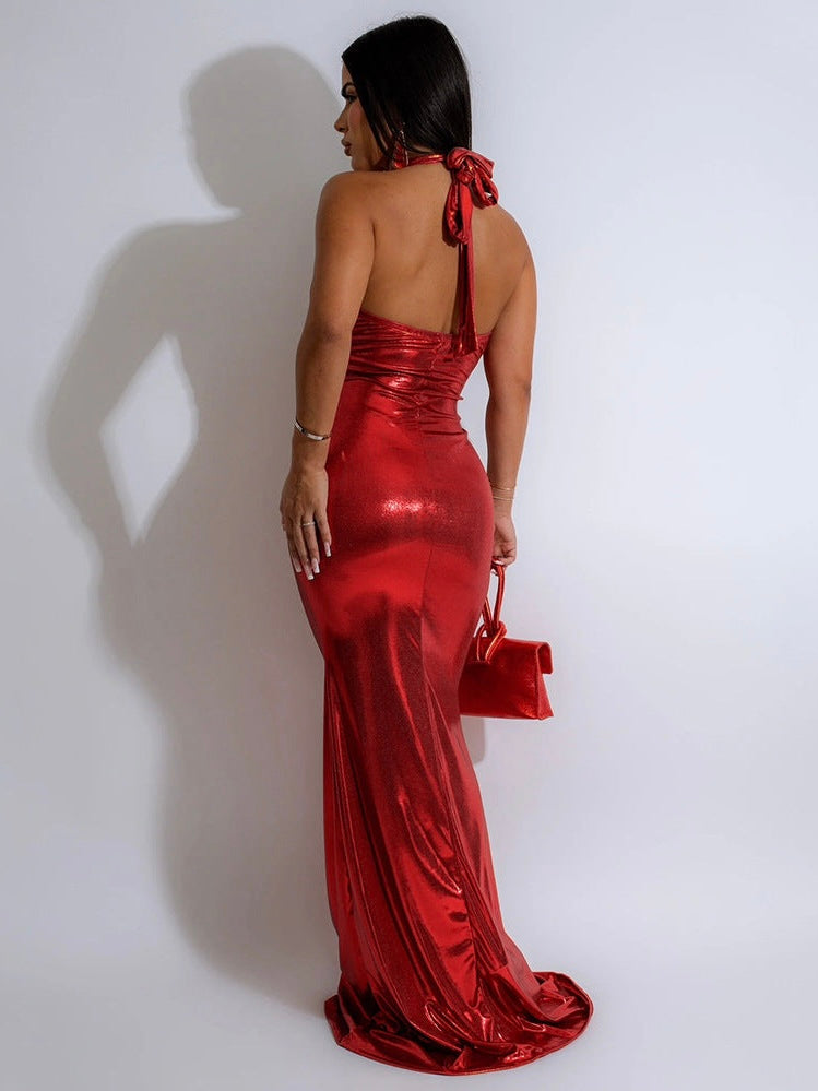 Striking red halter neck evening gown featuring a shimmering fabric and form-fitting silhouette. Perfect for elevating your style and making a statement at elegant events.