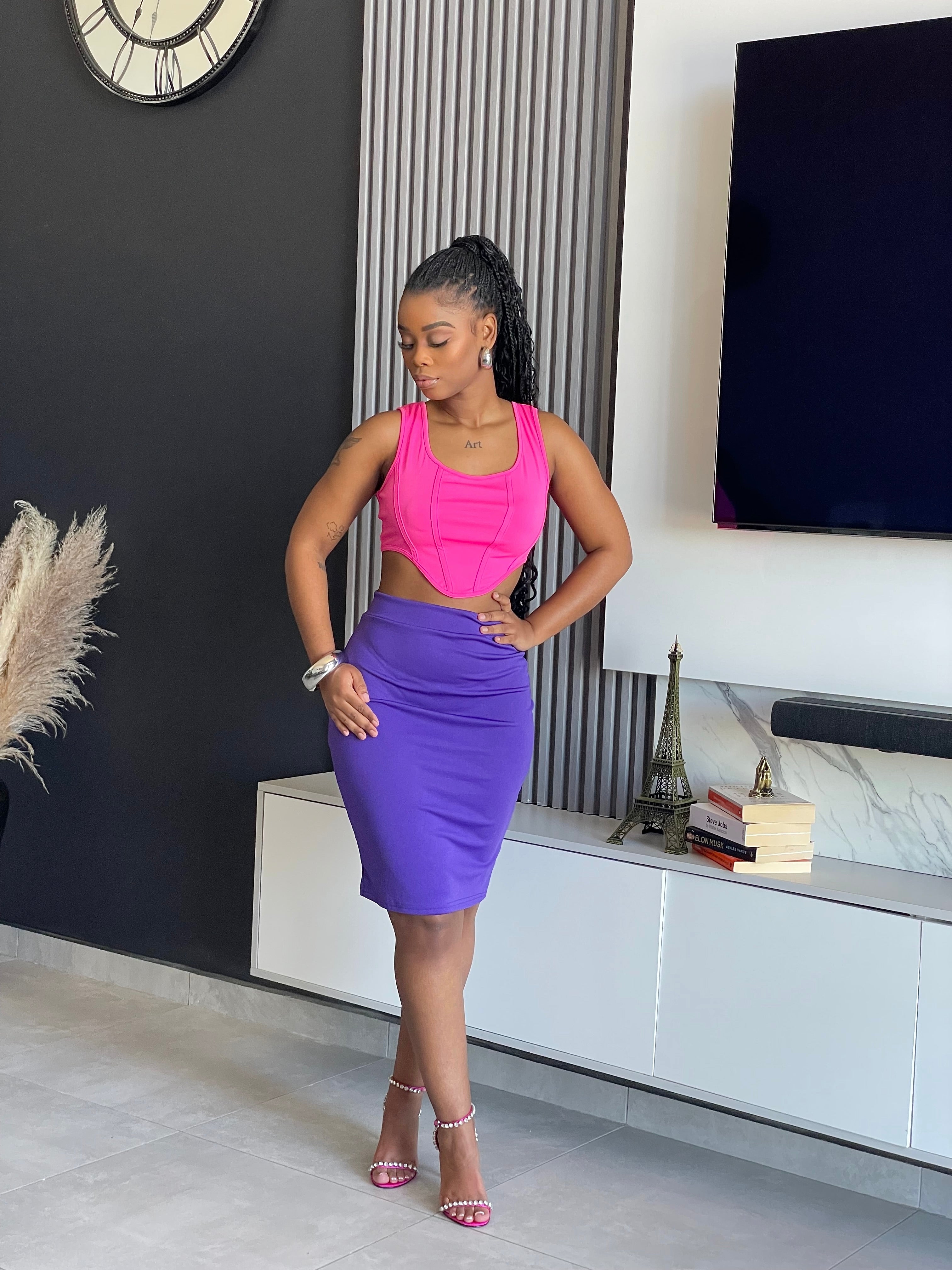 Model wearing the Aziza Two-Piece Skirt Set, featuring a bold top and skirt combination from Vera’s Closet.