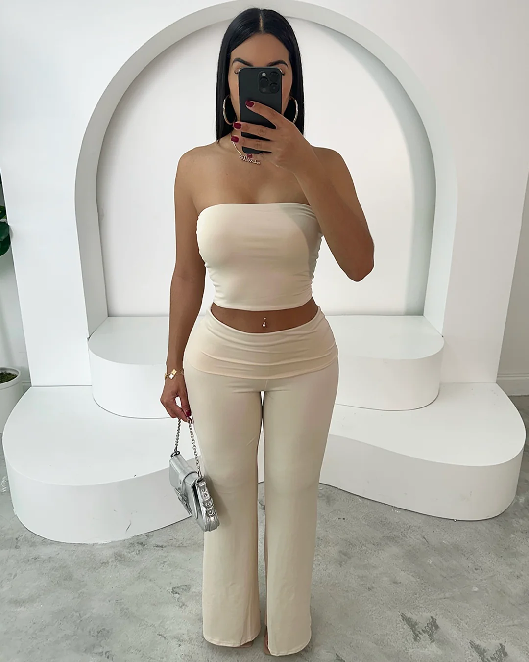 Model wearing Yves Pant Set in cream, showcasing a minimalist elegant style.