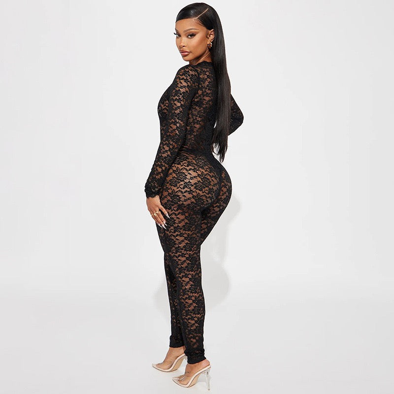 Celeste Lace Jumpsuit in sheer black floral lace with long sleeves and cut-out details