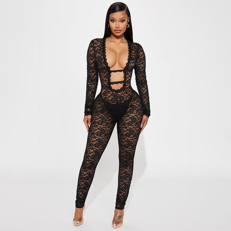 Celeste Lace Jumpsuit in sheer black floral lace with long sleeves and cut-out details