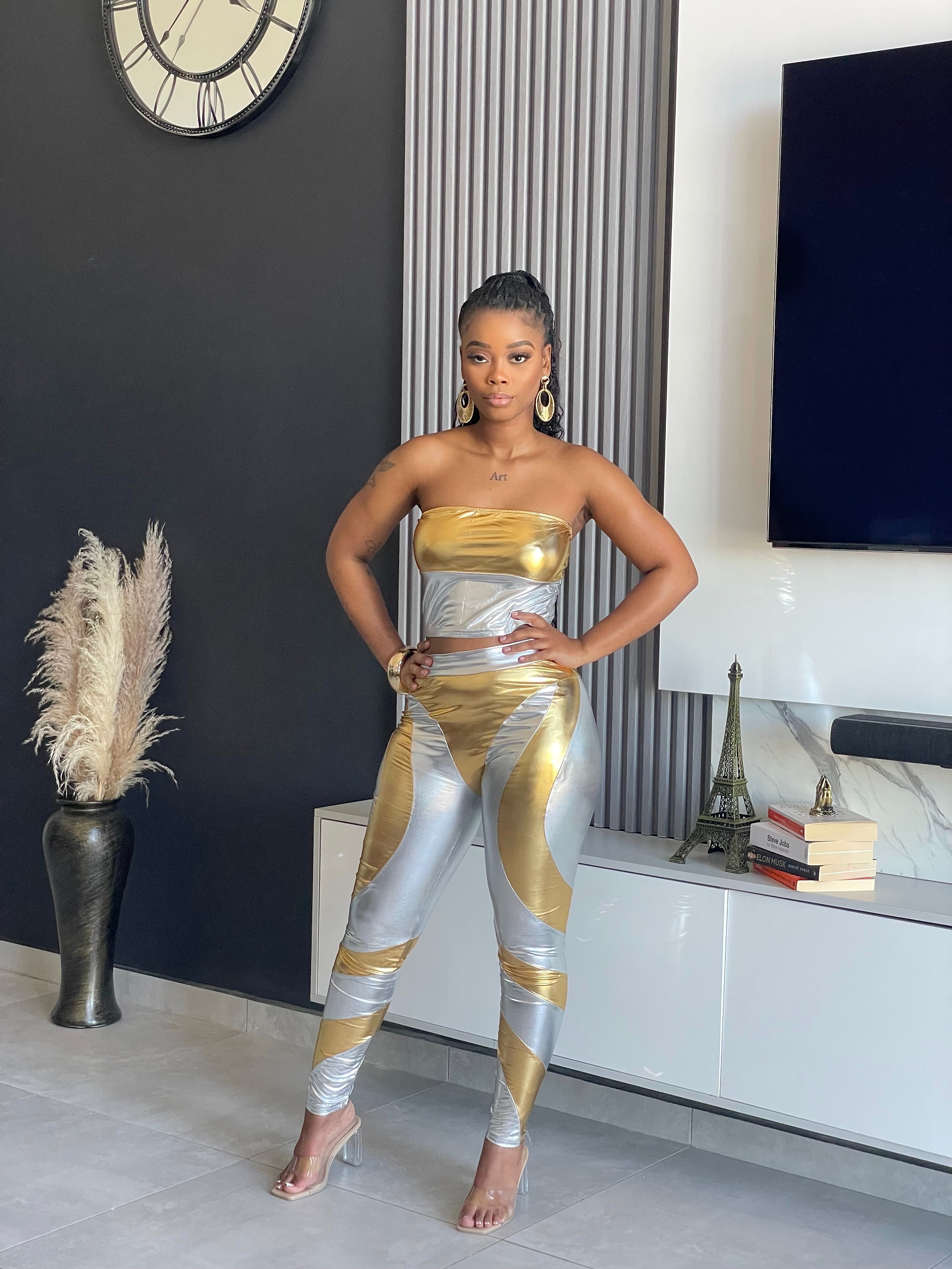 Split Decision Metallic Pant Set with strapless gold top and silver high-waisted leggings.