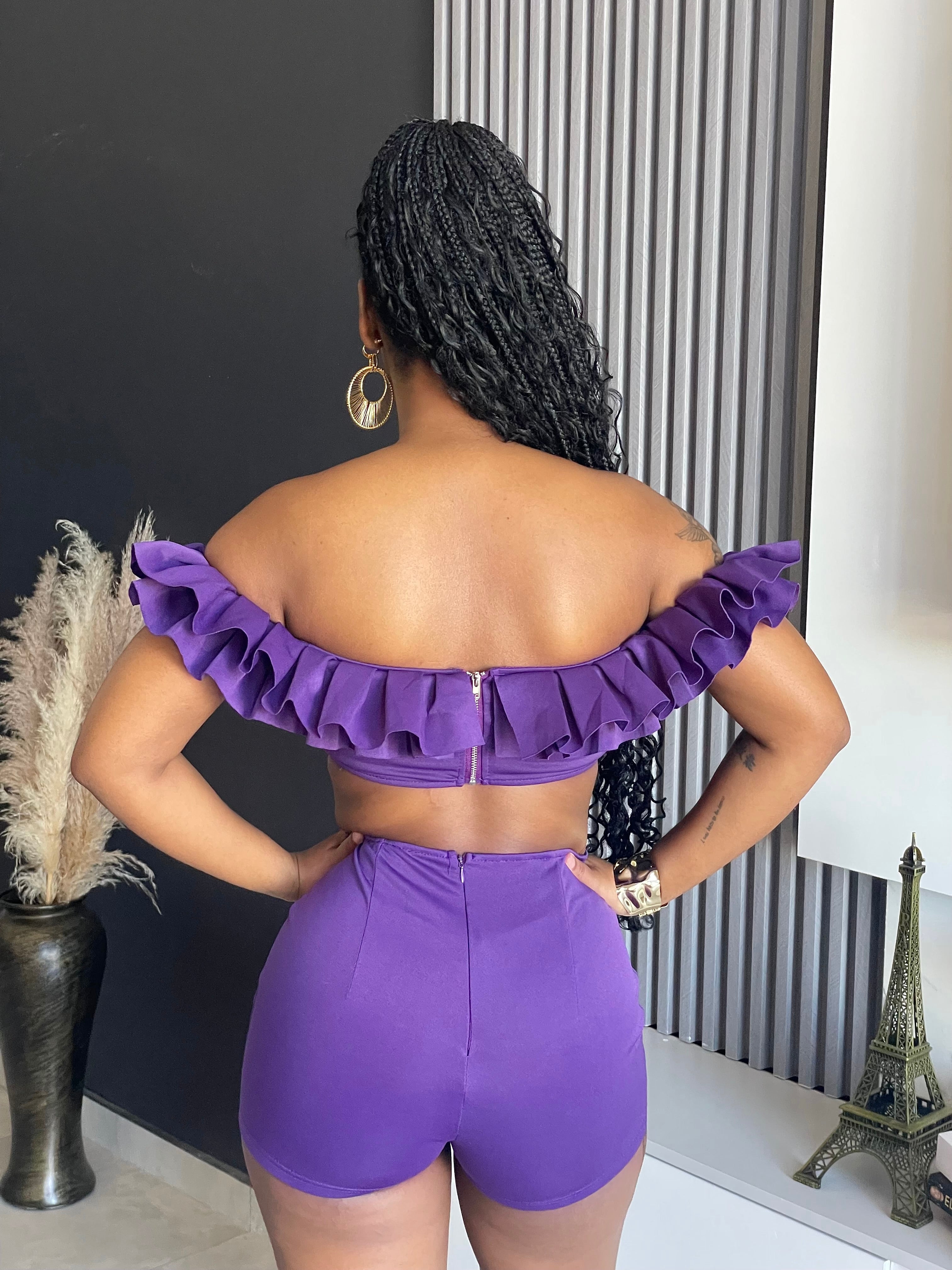 May Ruffle Short Set with off-shoulder ruffle crop top and high-waisted purple shorts.