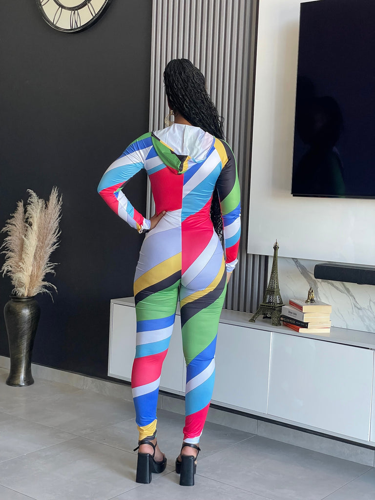 Tejah Jumpsuit with colorful geometric print, zip-up front, and fitted silhouette.