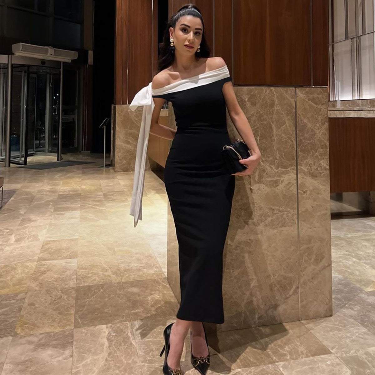 Sariyah Off-Shoulder Elegant Dress in black with a white bow accent, perfect for evening wear