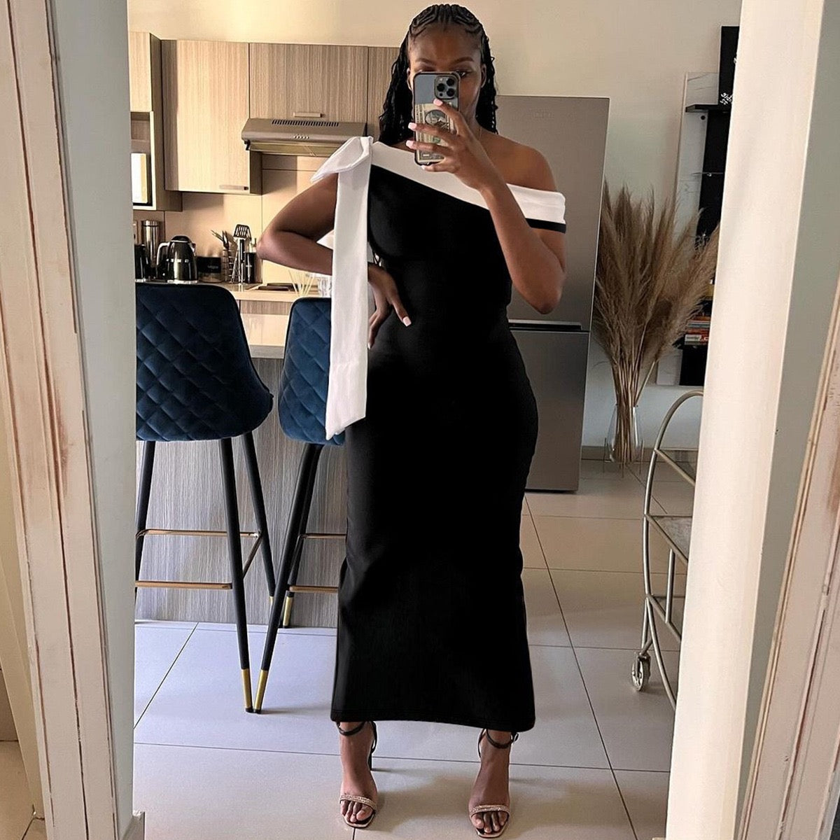 Sariyah Off-Shoulder Elegant Dress in black with a white bow accent, perfect for evening wear