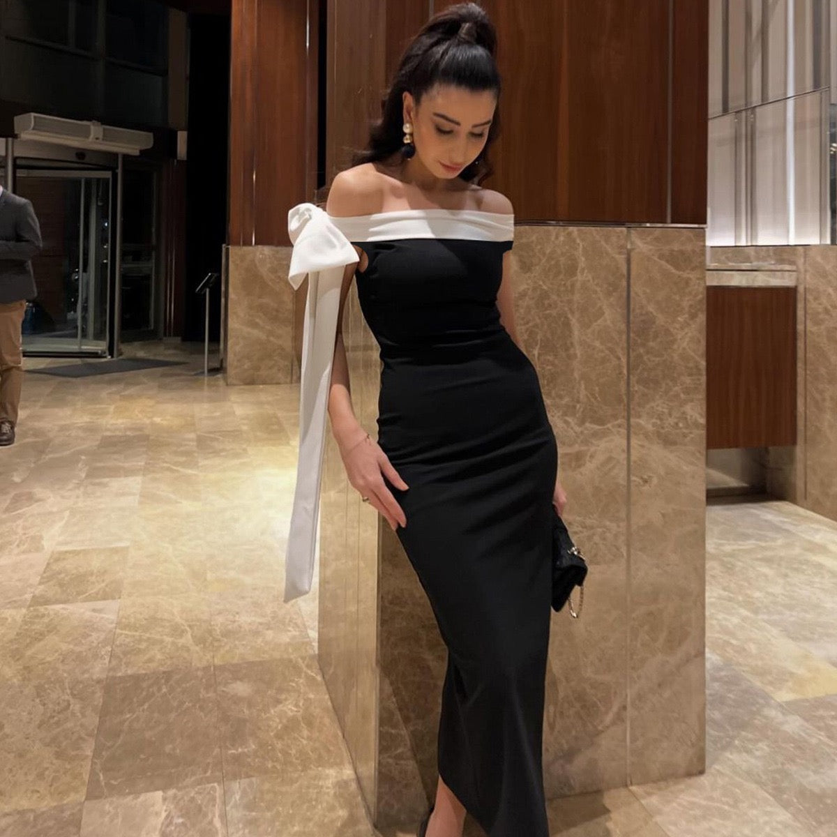 Sariyah Off-Shoulder Elegant Dress in black with a white bow accent, perfect for evening wear