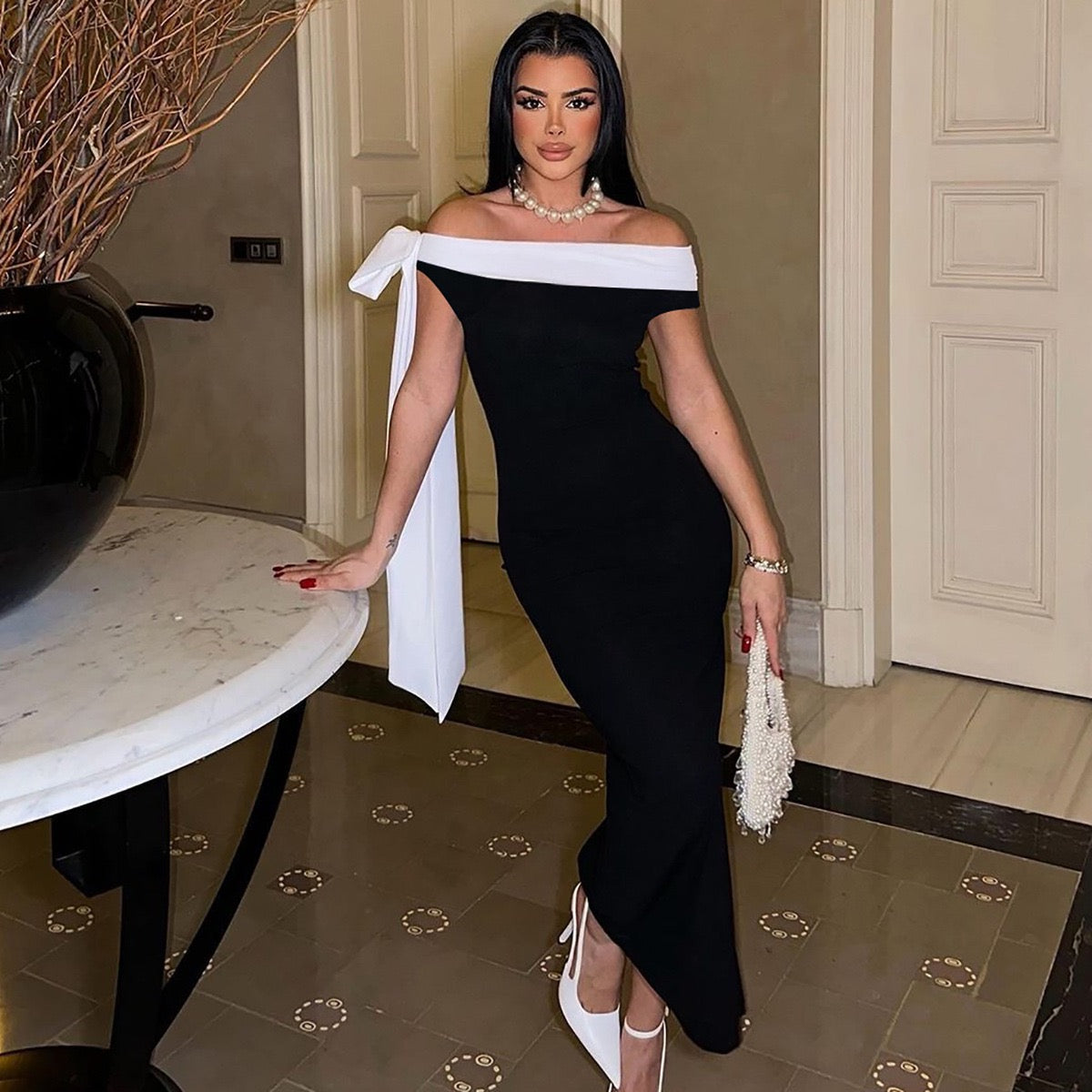 Sariyah Off-Shoulder Elegant Dress in black with a white bow accent, perfect for evening wear