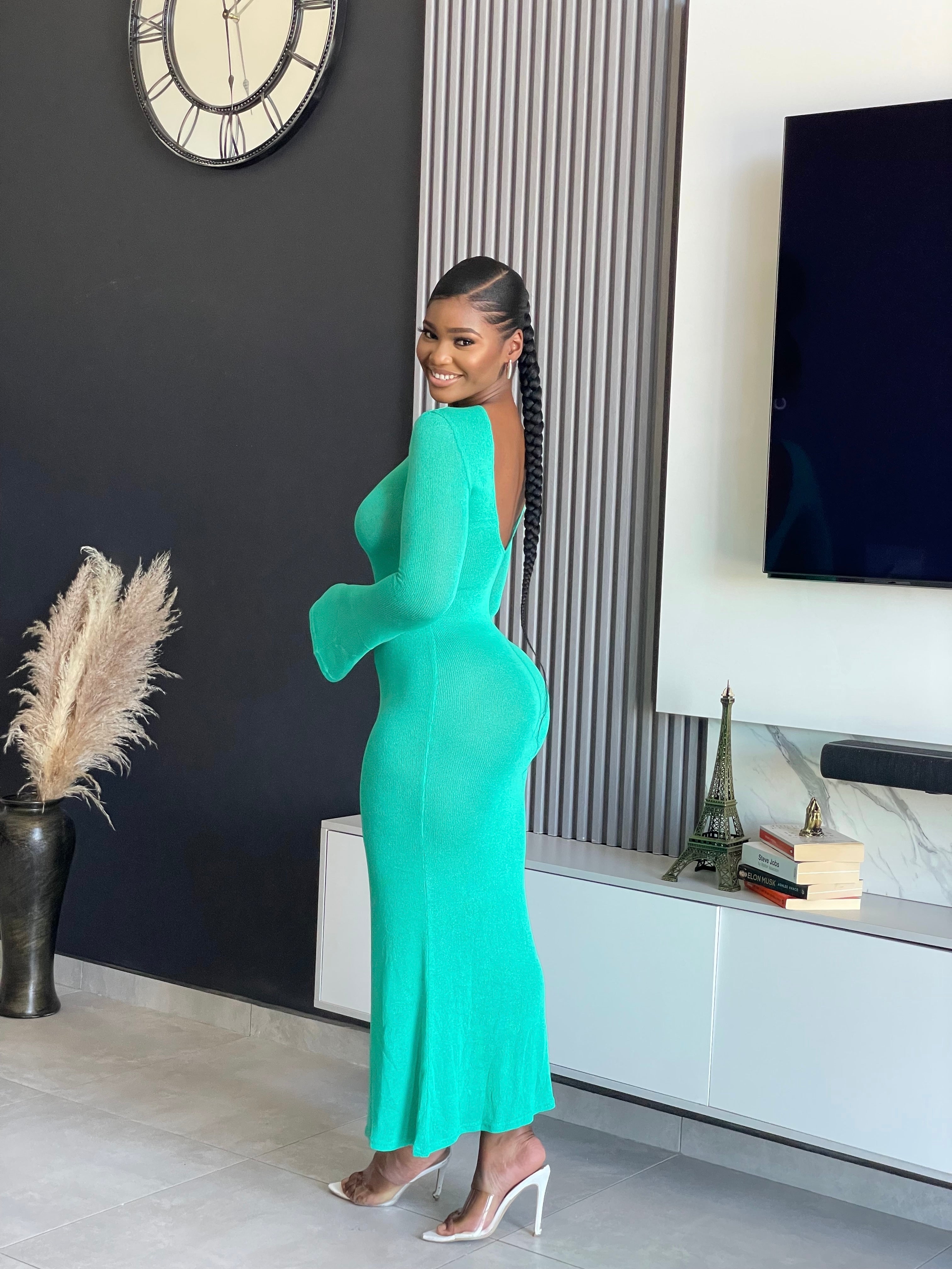 A woman wearing the Just for You Elegant Maxi Dress in teal, showcasing a form-fitting design with a long flowing silhouette, perfect for special occasions.