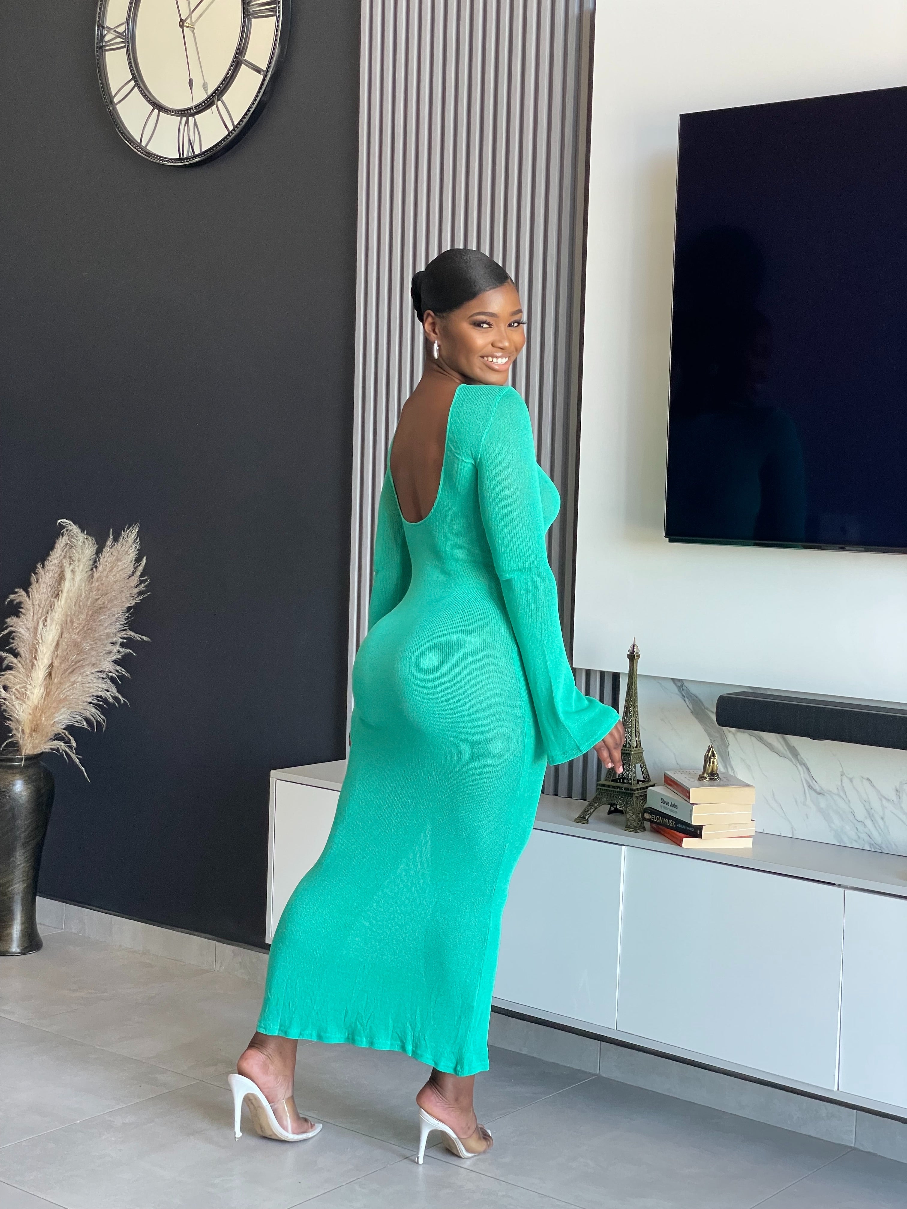 A woman wearing the Just for You Elegant Maxi Dress in teal, showcasing a form-fitting design with a long flowing silhouette, perfect for special occasions.