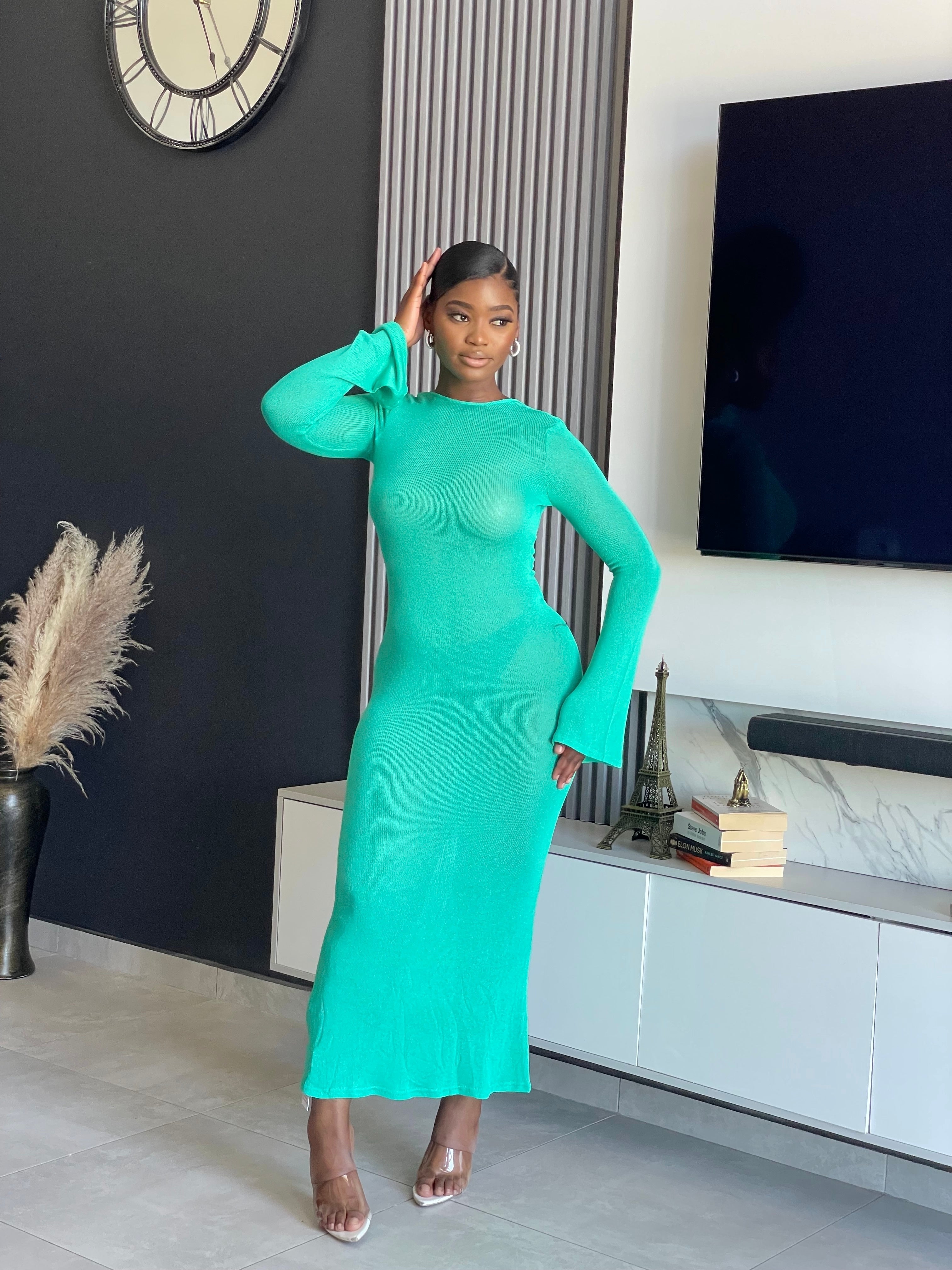 A woman wearing the Just for You Elegant Maxi Dress in teal, showcasing a form-fitting design with a long flowing silhouette, perfect for special occasions.