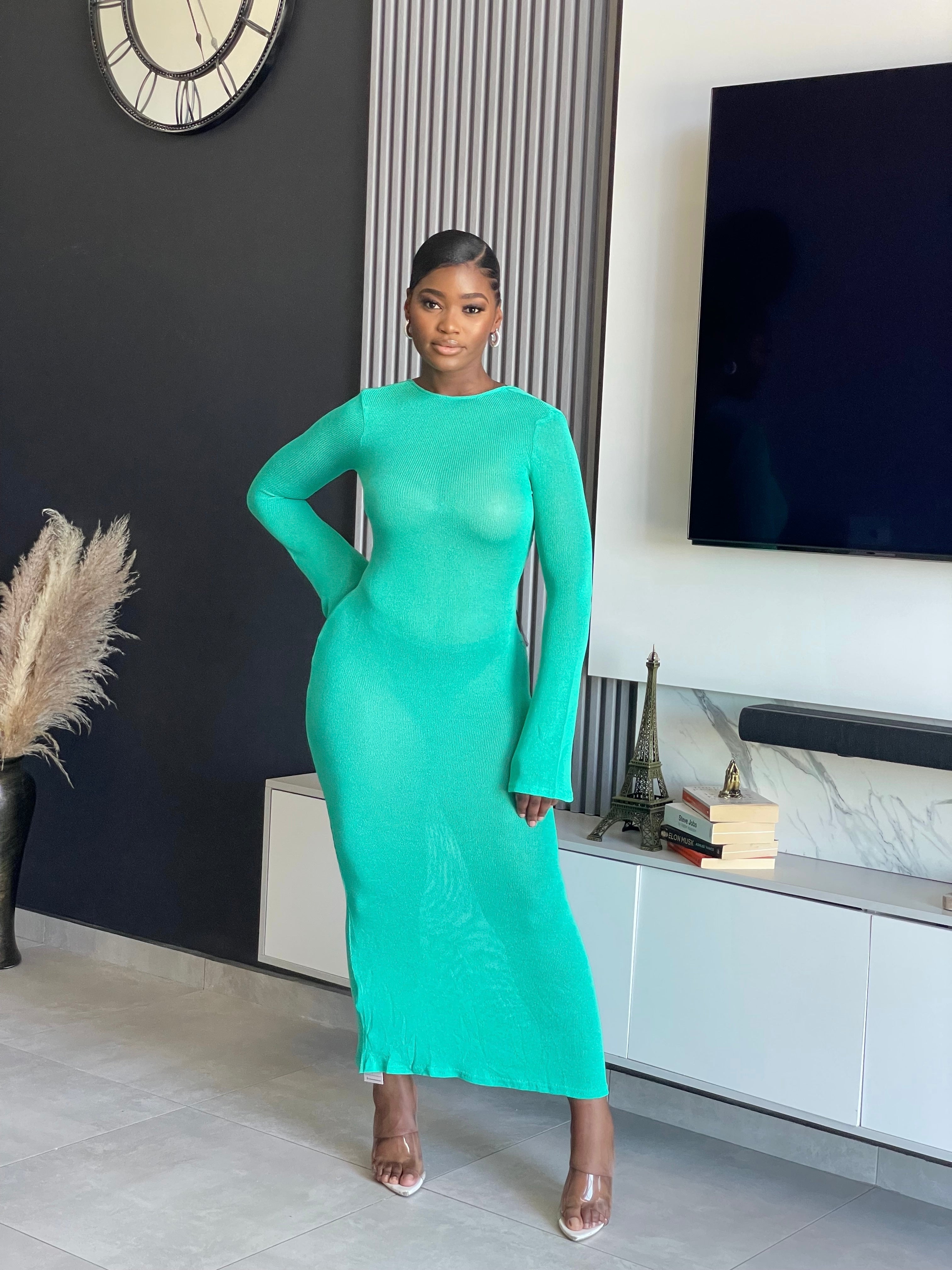 A woman wearing the Just for You Elegant Maxi Dress in teal, showcasing a form-fitting design with a long flowing silhouette, perfect for special occasions.