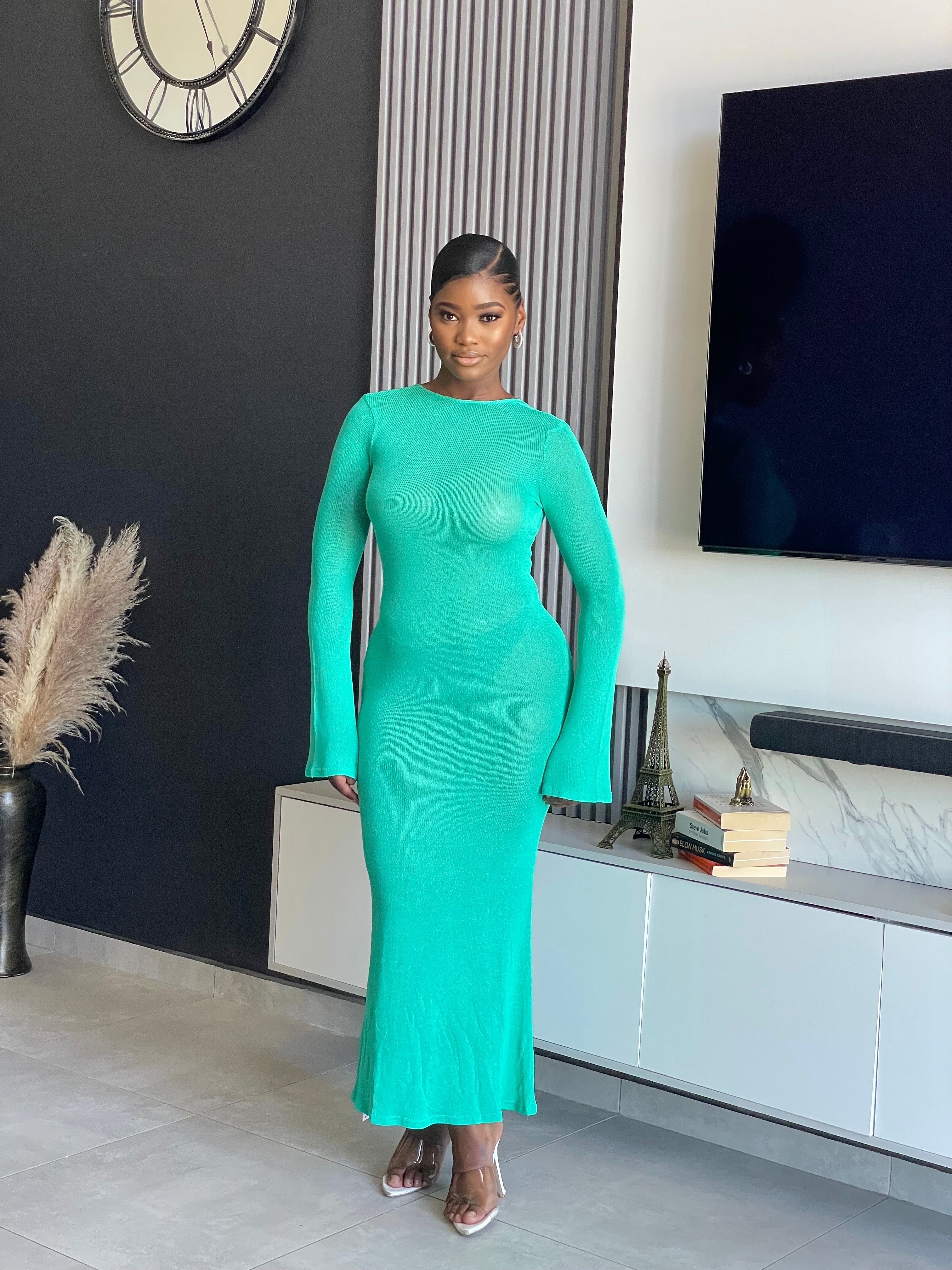 A woman wearing the Just for You Elegant Maxi Dress in teal, showcasing a form-fitting design with a long flowing silhouette, perfect for special occasions.