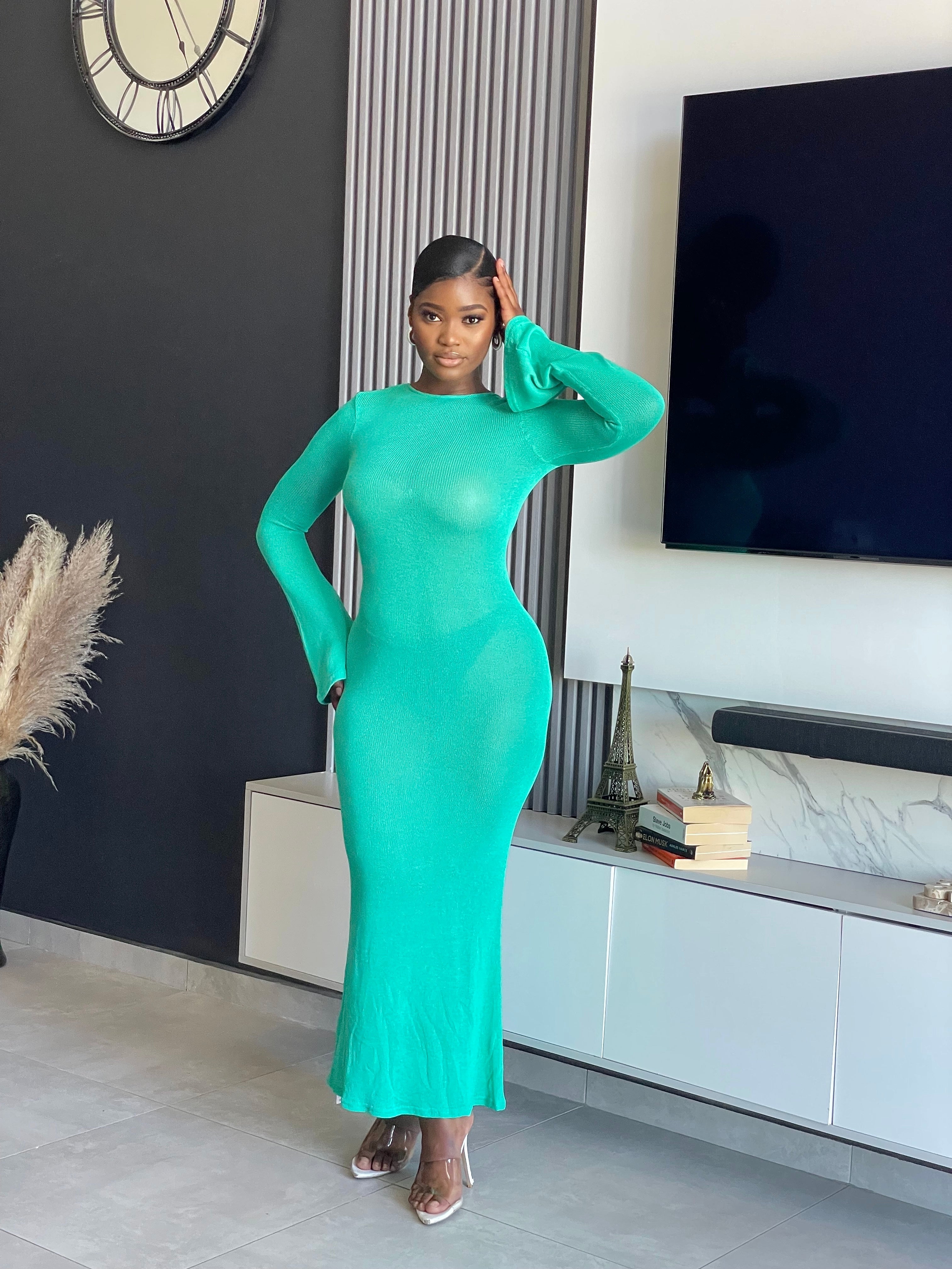 A woman wearing the Just for You Elegant Maxi Dress in teal, showcasing a form-fitting design with a long flowing silhouette, perfect for special occasions.