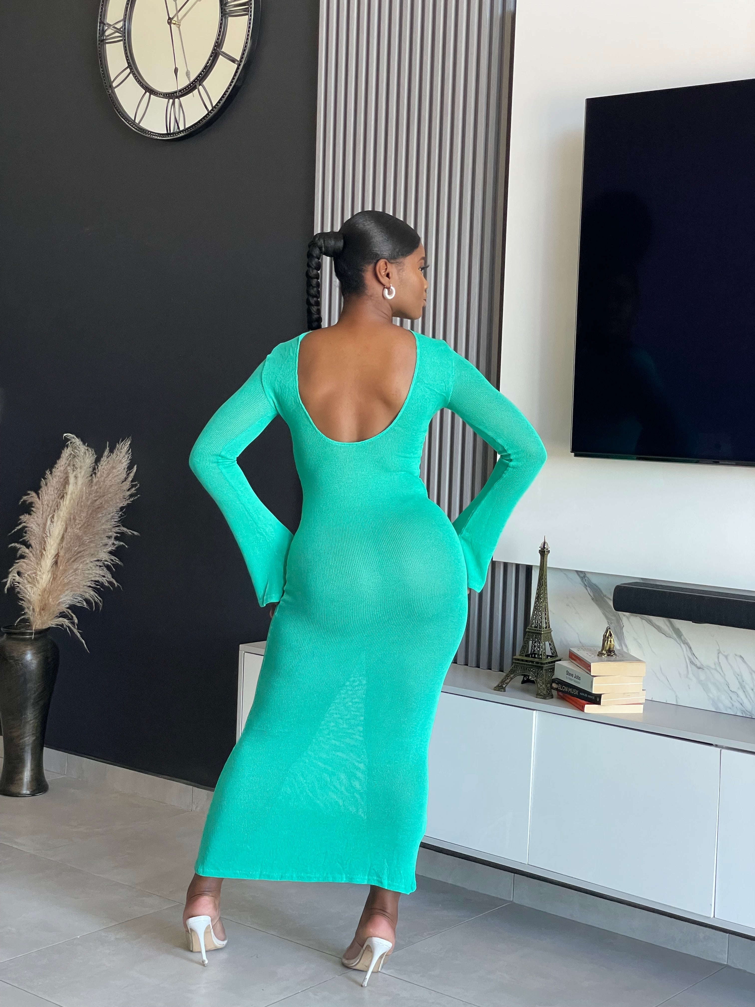 A woman wearing the Just for You Elegant Maxi Dress in teal, showcasing a form-fitting design with a long flowing silhouette, perfect for special occasions.