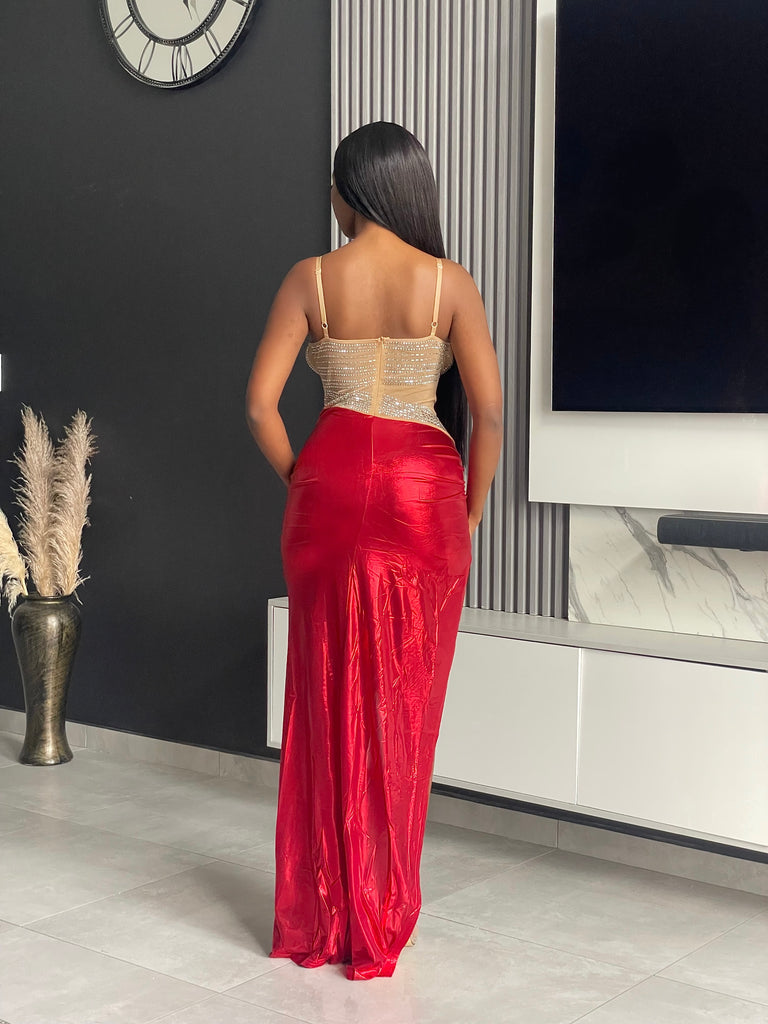 Model wearing Lorne Maxi Dress with gold bodice and red satin skirt, ideal for formal events.