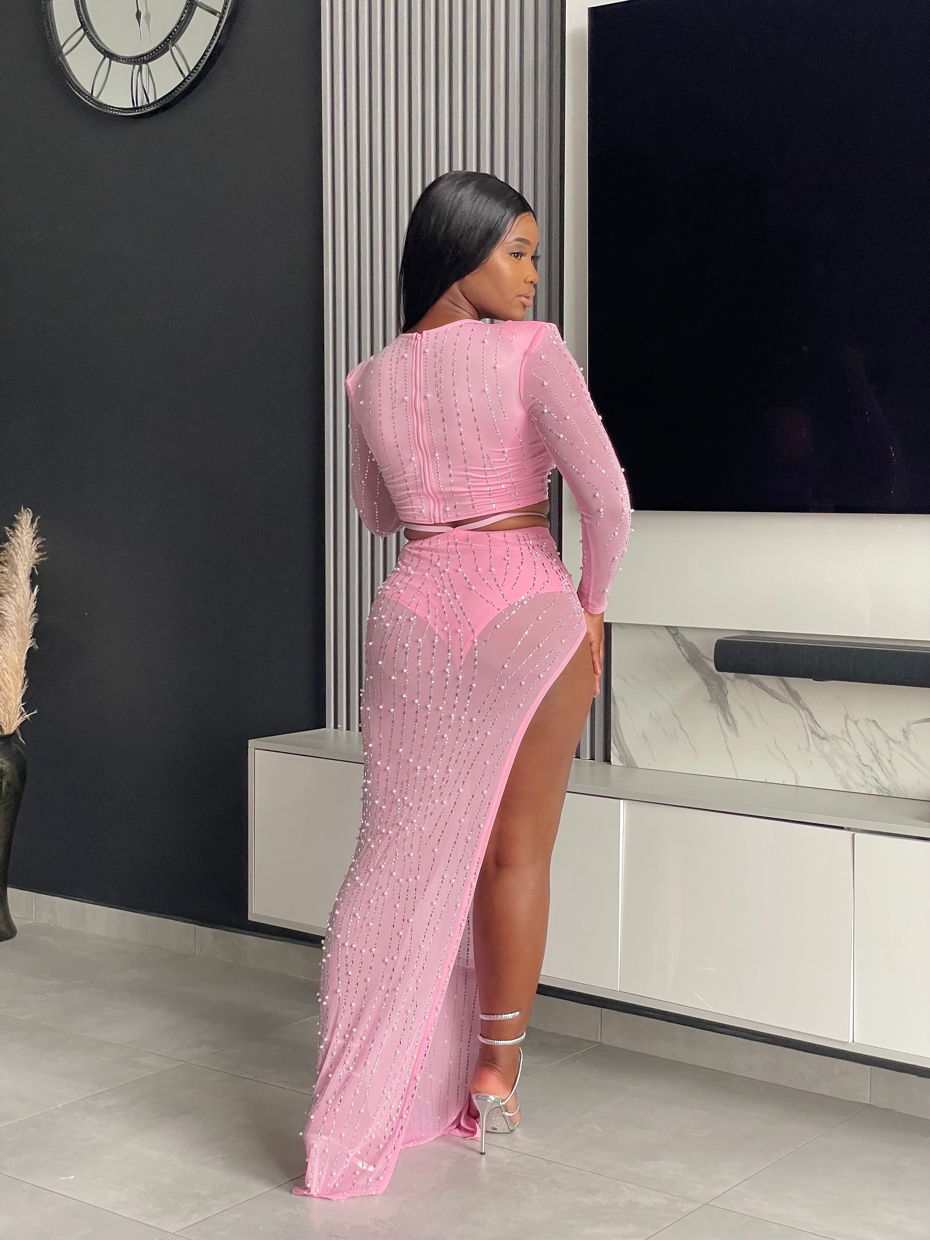 Model showcasing the Lasique Skirt Set in pink with beautiful embellishments and elegant design, perfect for special occasions.