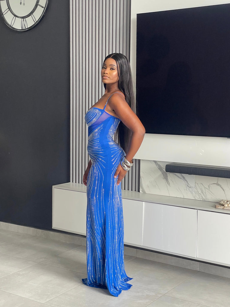 Model wearing the Tejah Maxi Dress in royal blue with sequin details, posing elegantly.