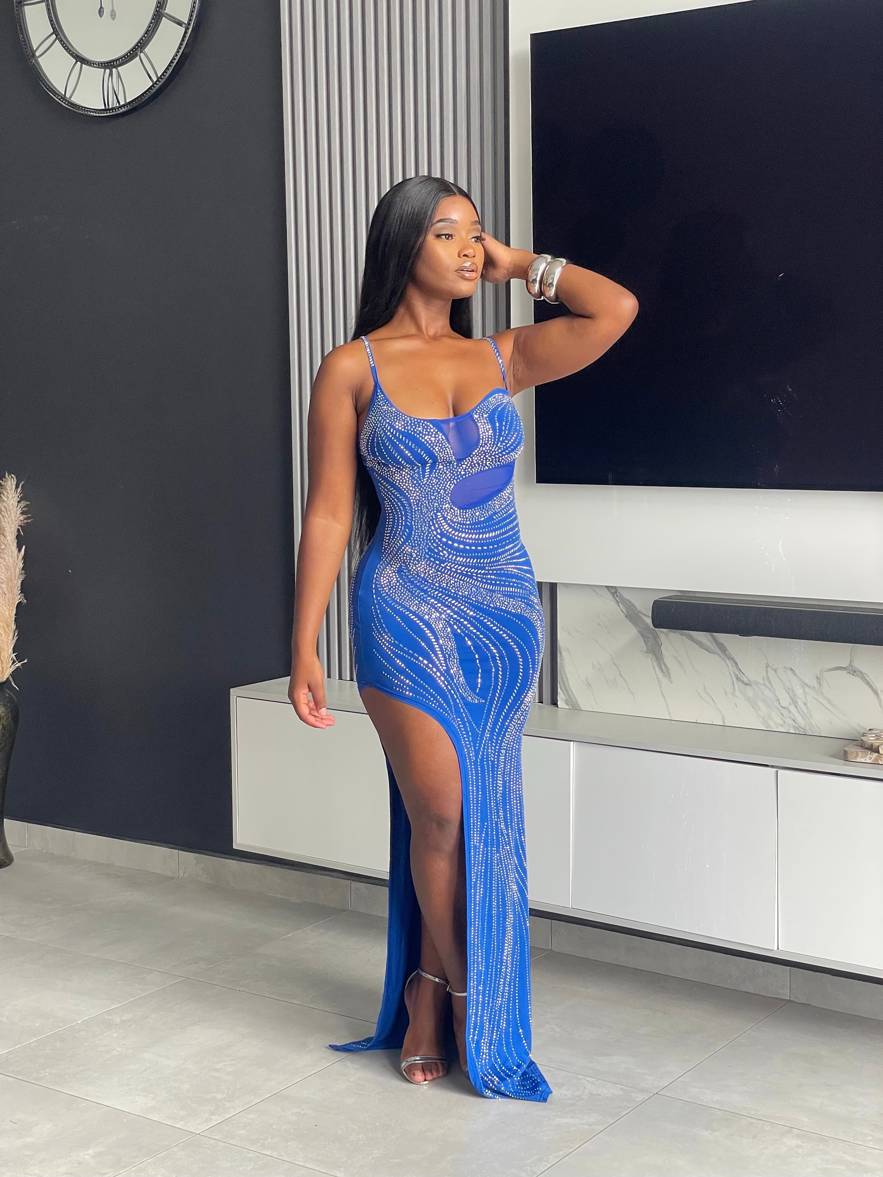 Model wearing the Tejah Maxi Dress in royal blue with sequin details, posing elegantly.