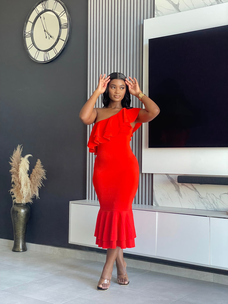 Embrace elegance with the Edeline Midi Dress, featuring a striking red hue and stylish ruffle accents. Perfect for any special occasion or evening event. Shop now!