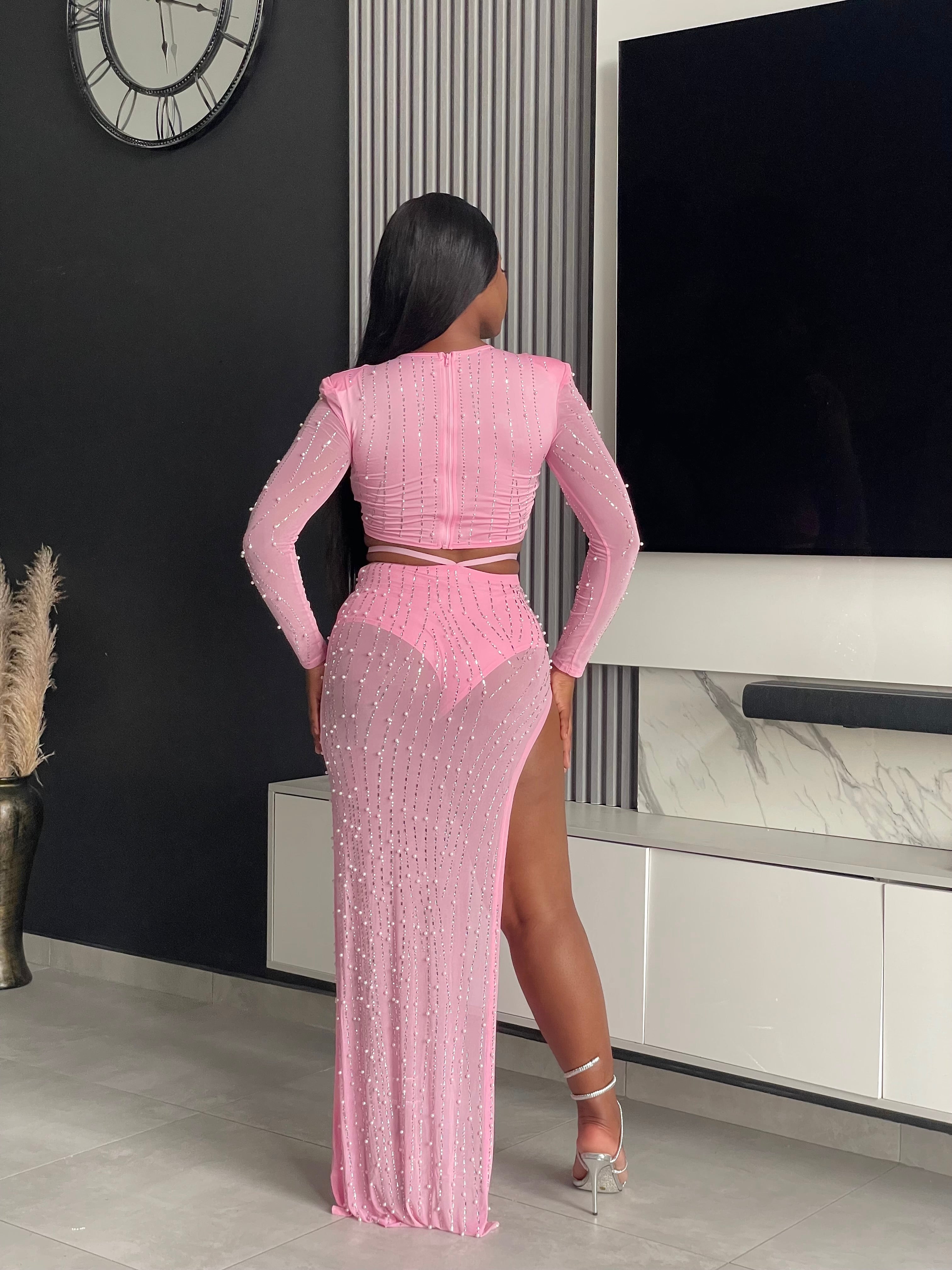 Model showcasing the Lasique Skirt Set in pink with beautiful embellishments and elegant design, perfect for special occasions.