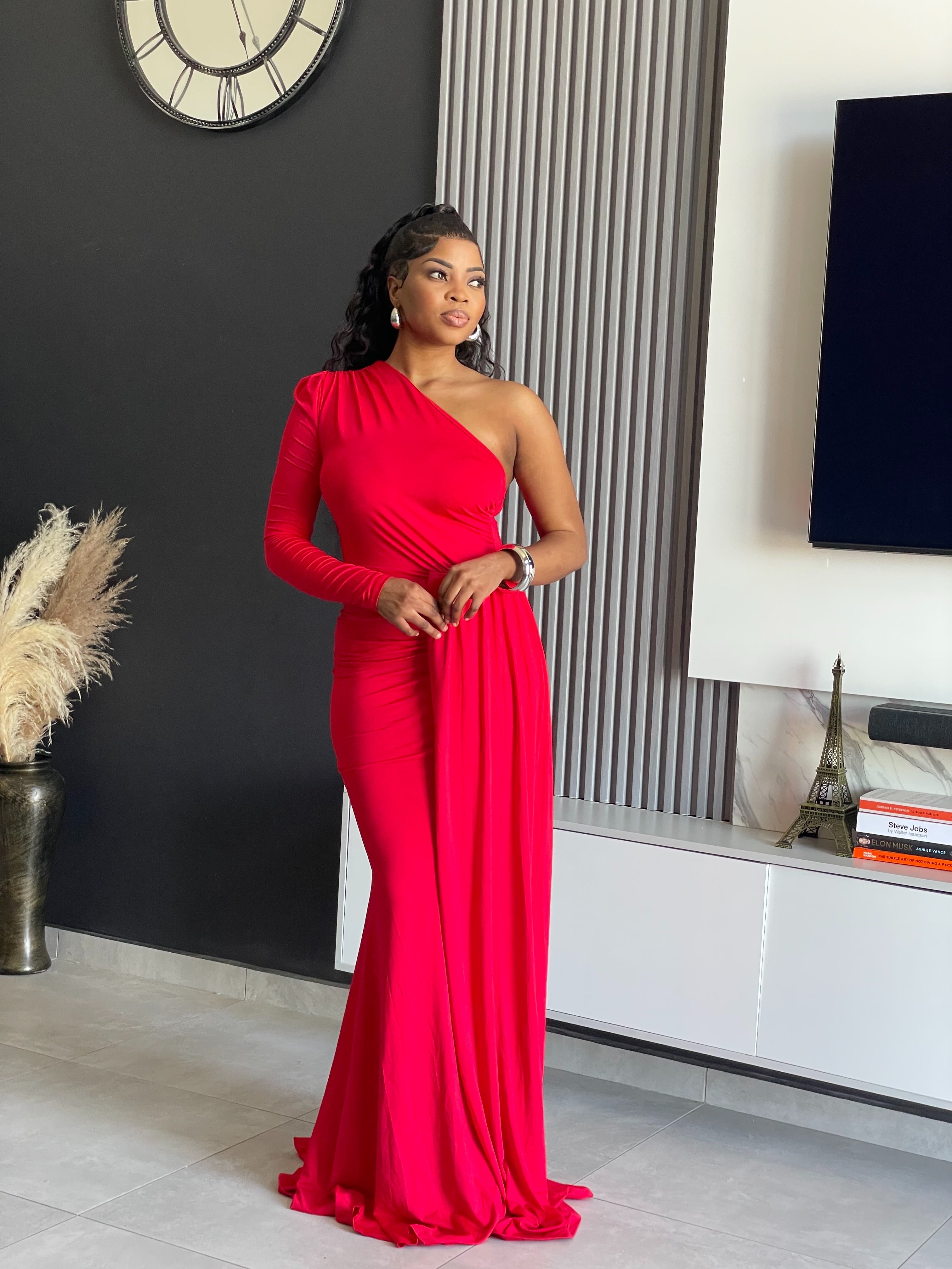 A woman wearing the Londyn Elegant Maxi Dress in rich red, featuring a one-shoulder design and flowing silhouette, ideal for formal occasions and galas