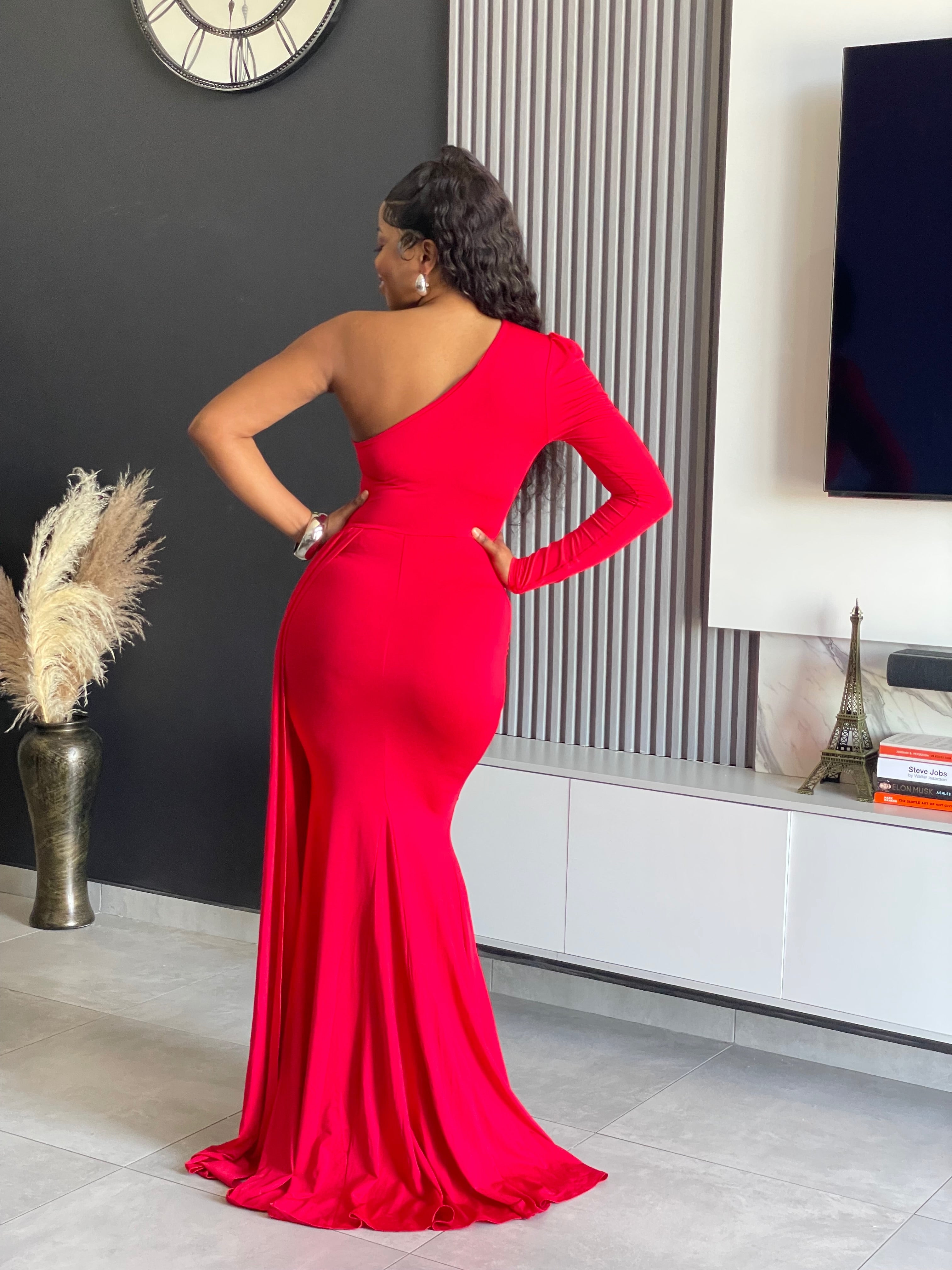 A woman wearing the Londyn Elegant Maxi Dress in rich red, featuring a one-shoulder design and flowing silhouette, ideal for formal occasions and galas