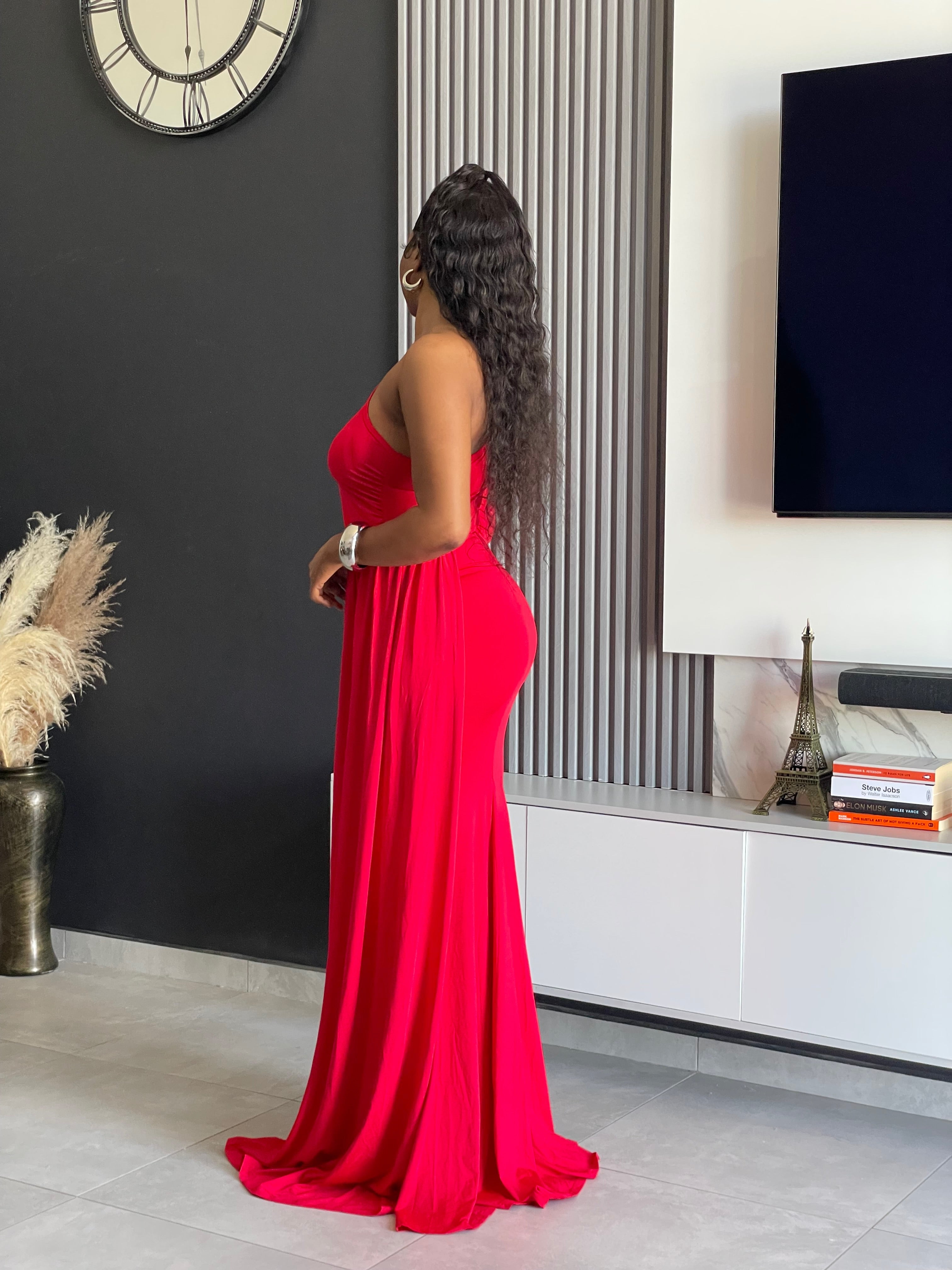 A woman wearing the Londyn Elegant Maxi Dress in rich red, featuring a one-shoulder design and flowing silhouette, ideal for formal occasions and galas